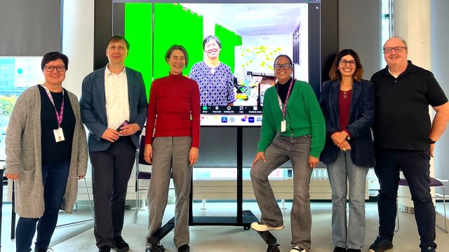 Six people in front of a screen