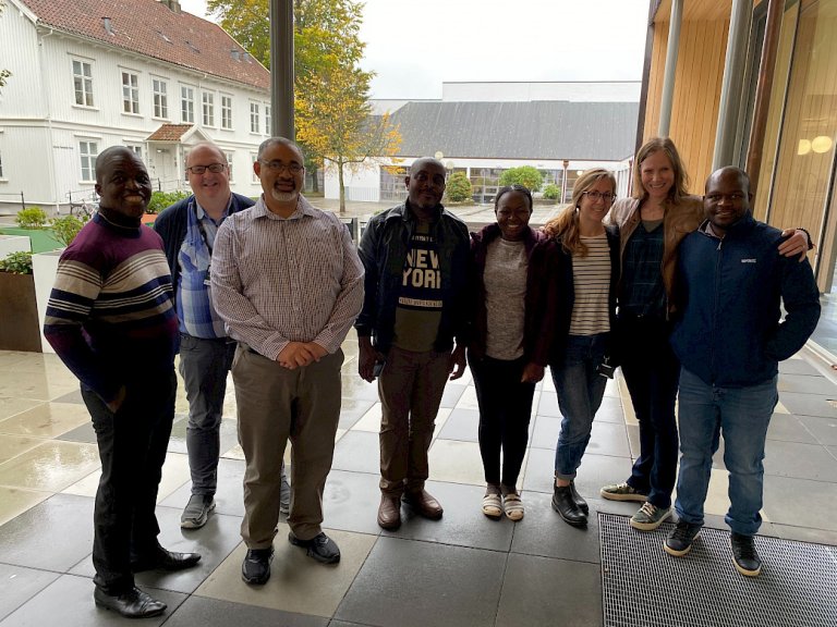 Group photo with 5 men and 3 women at Stavanger campus