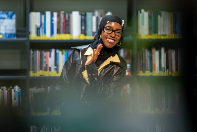 Happy woman in library