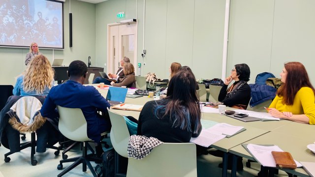 Scholars in a classroom.